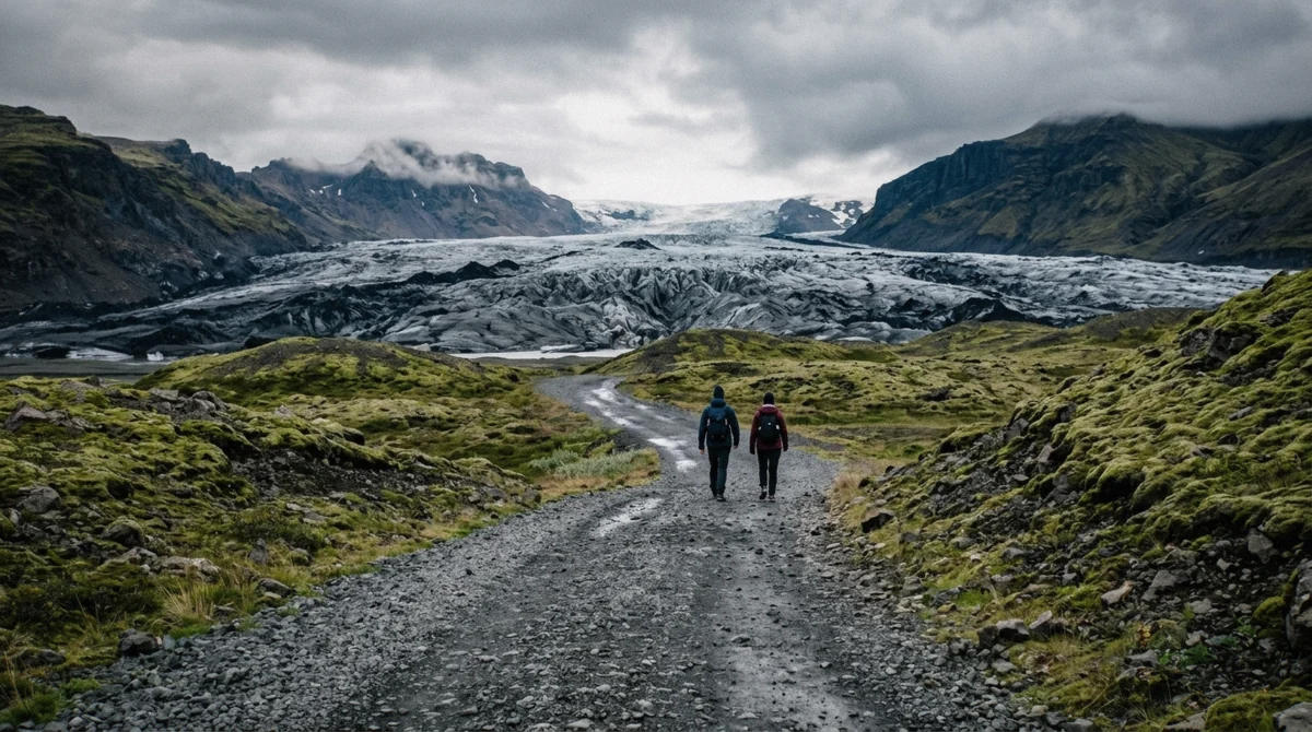 The flat gravel path from the car park toward the ice on a Sólheimajökull glacier hike without a guide, South Iceland